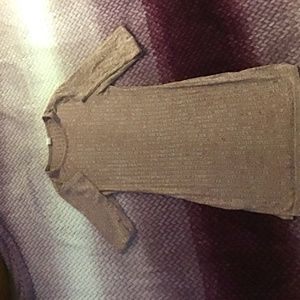 A long shirt with a slit at the end also with long sleeve and a size 12/13Y